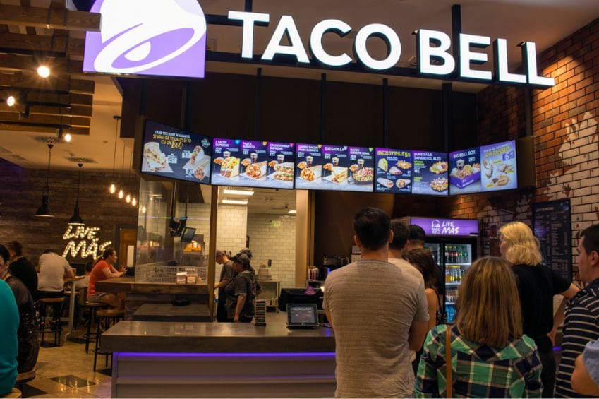 Customers at the counter of Taco Bell.