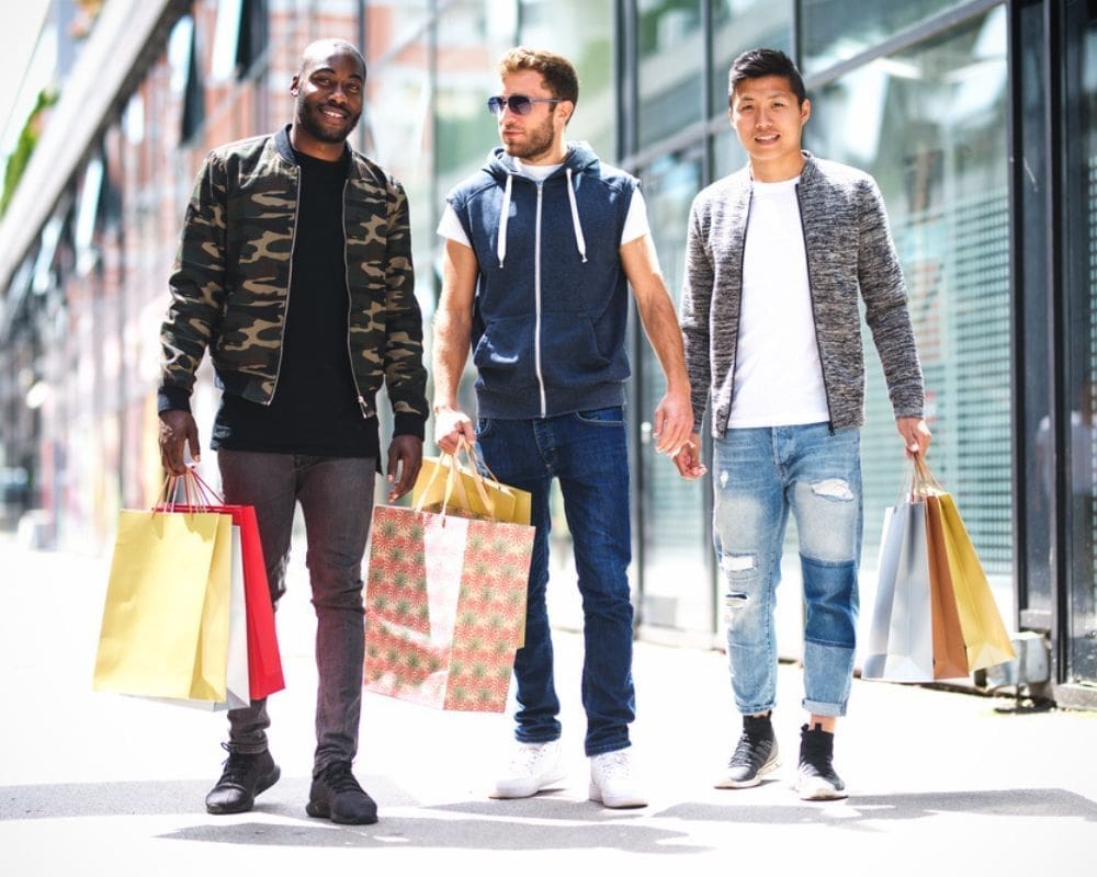 Men holding shopping bags on high street